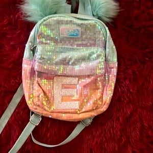 Used pink and blue kids mini bookbag. Also bought a few years ago.